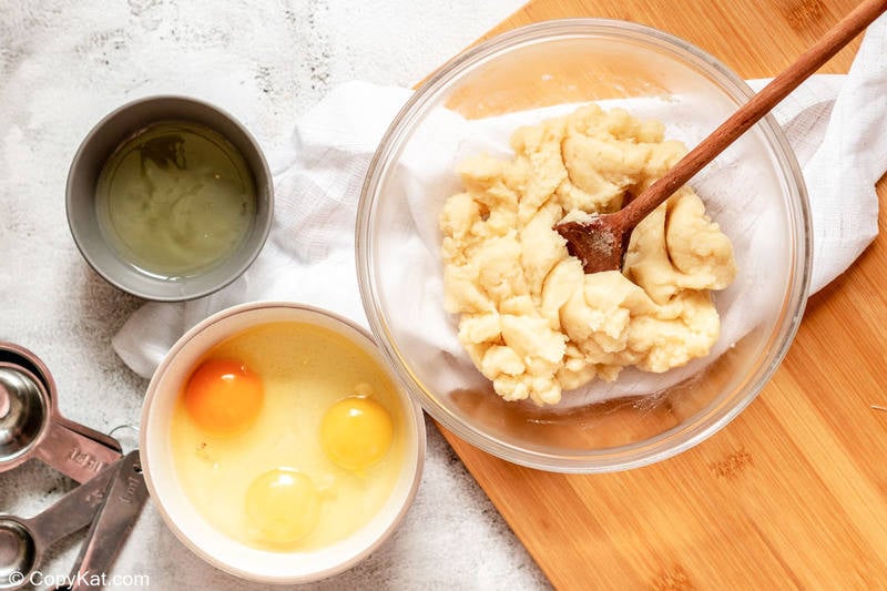 cooked French cruller dough, eggs, and egg whites