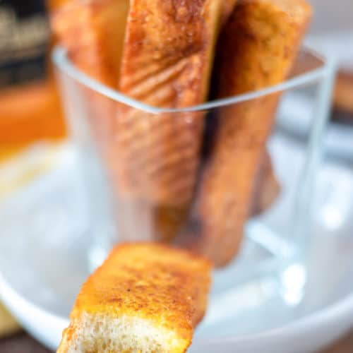 french toast sticks with a bite taken out of one