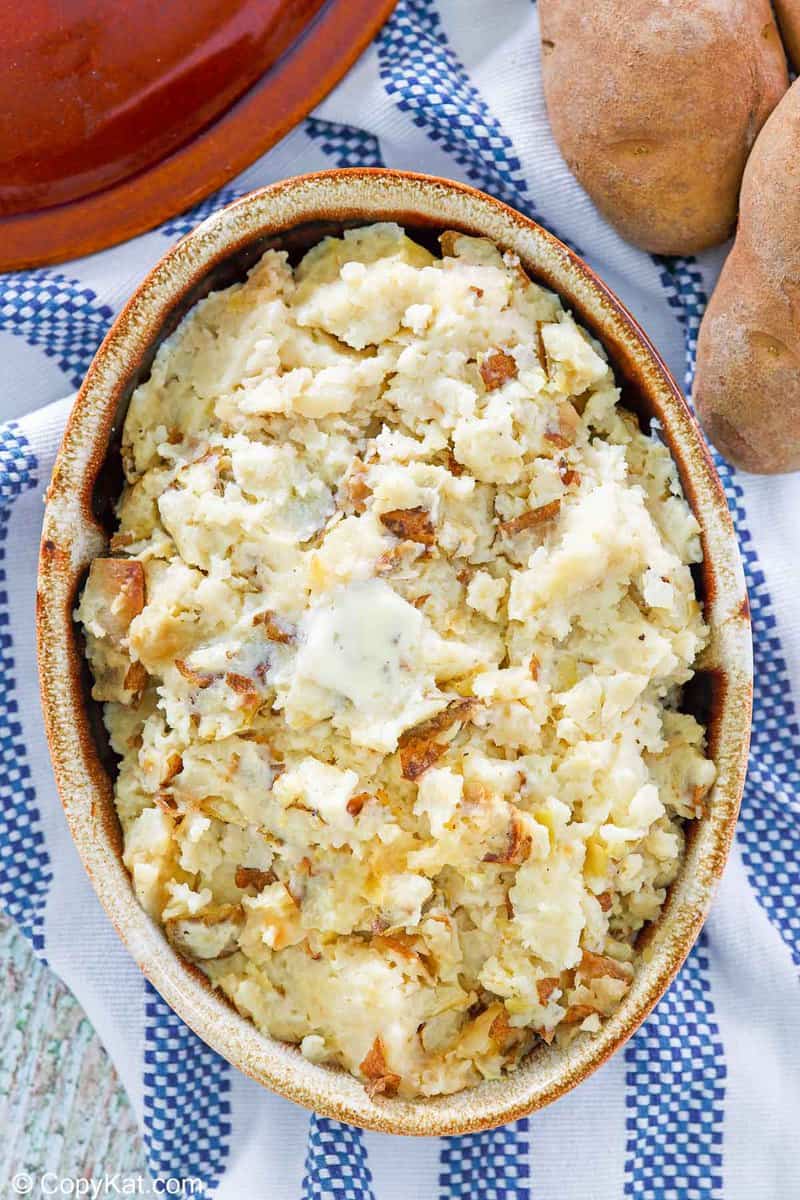 overhead view of garlic mashed potatoes in a serving dish