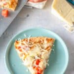 overhead view of a slice of homemade Olive Garden chicken formaggio pizza