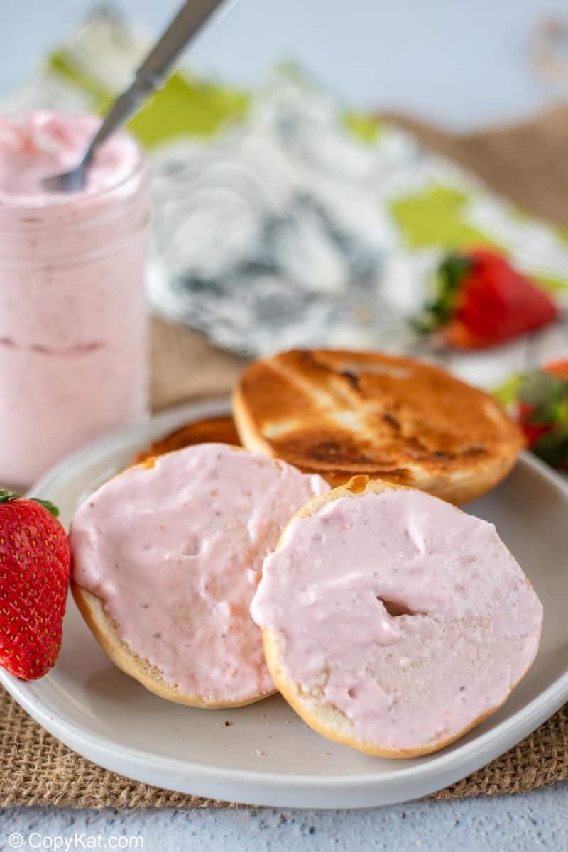 strawberry cream cheese spread on a bagel