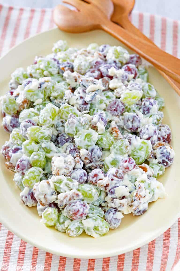grape salad and salad tongs on a platter