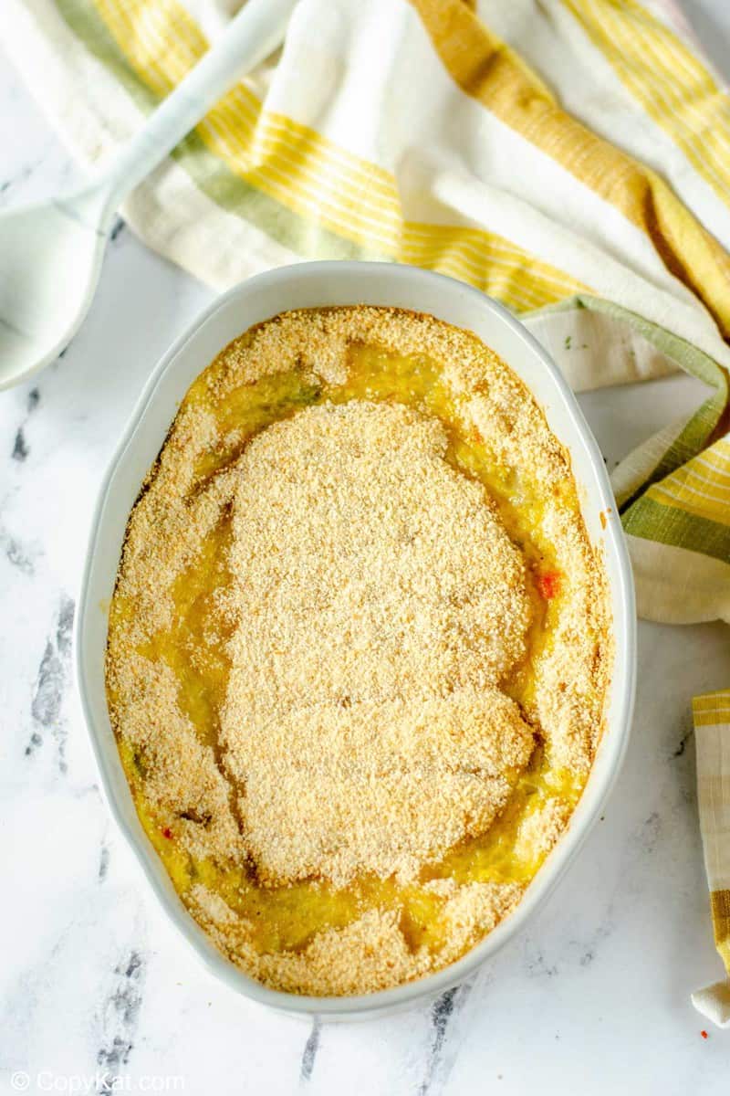 scalloped corn in an oval baking dish