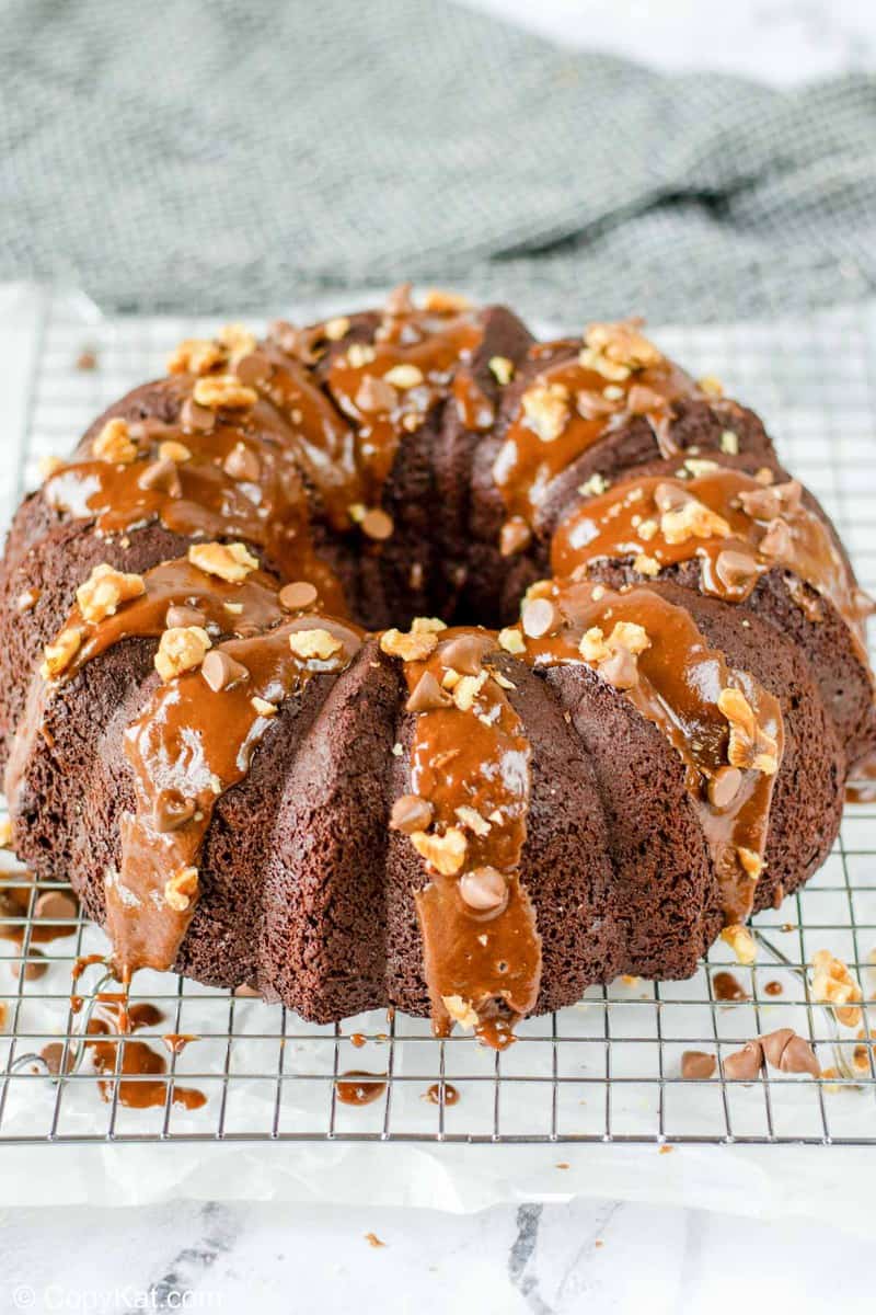 glazed chocolate bundt cake on a wire rack.