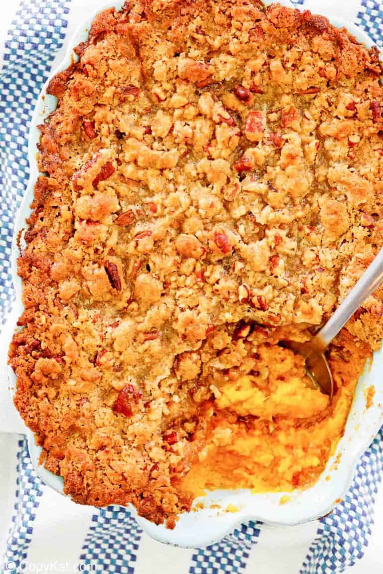 overhead view of sweet potato souffle with pecans in a baking dish.