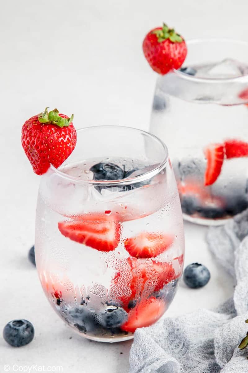 Berry infused water in two glasses.