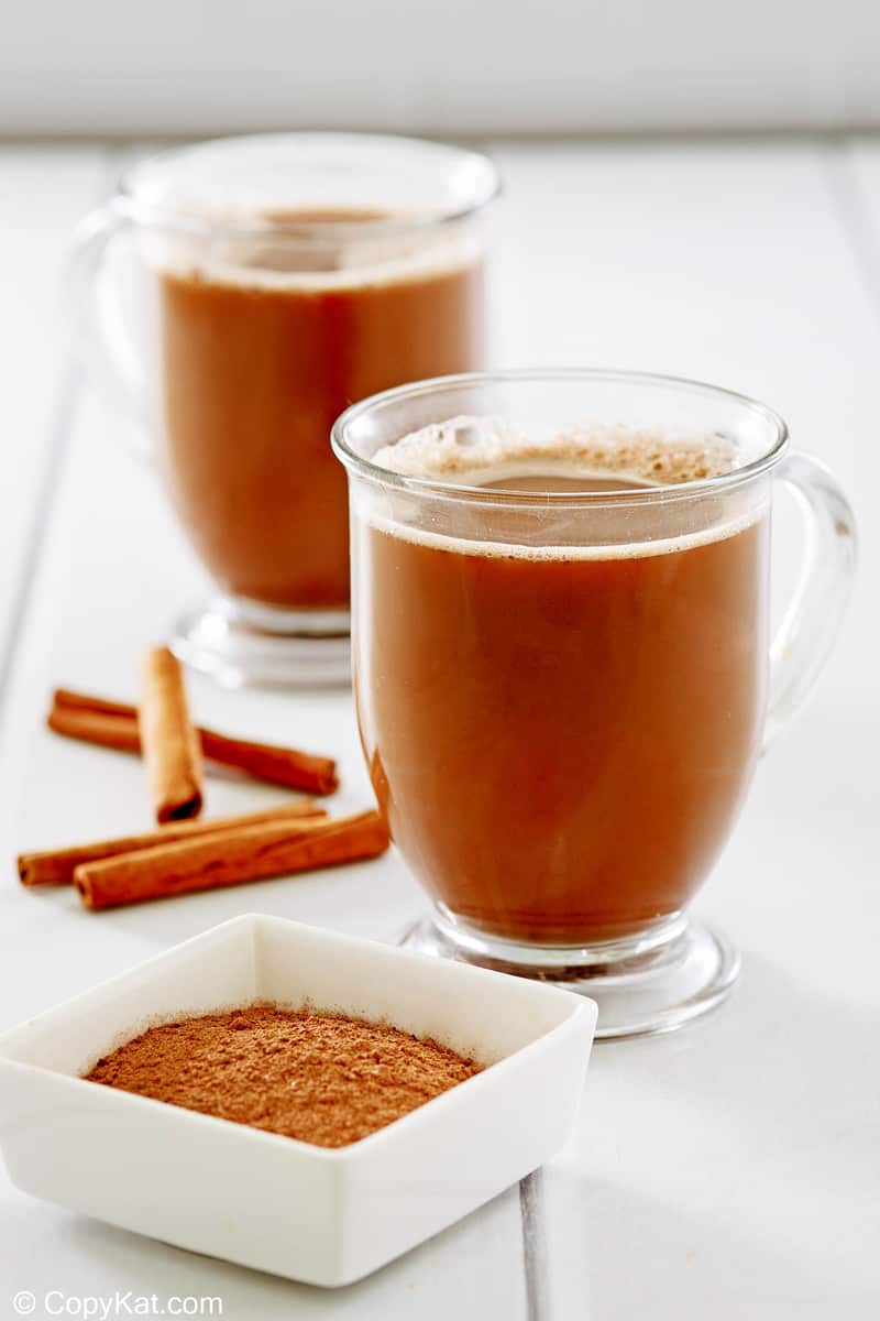 Mexican coffee in glass mugs and cinnamon sticks