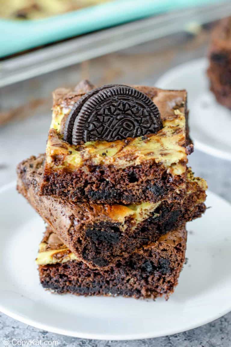 a stack of three Oreo brownies on a plate