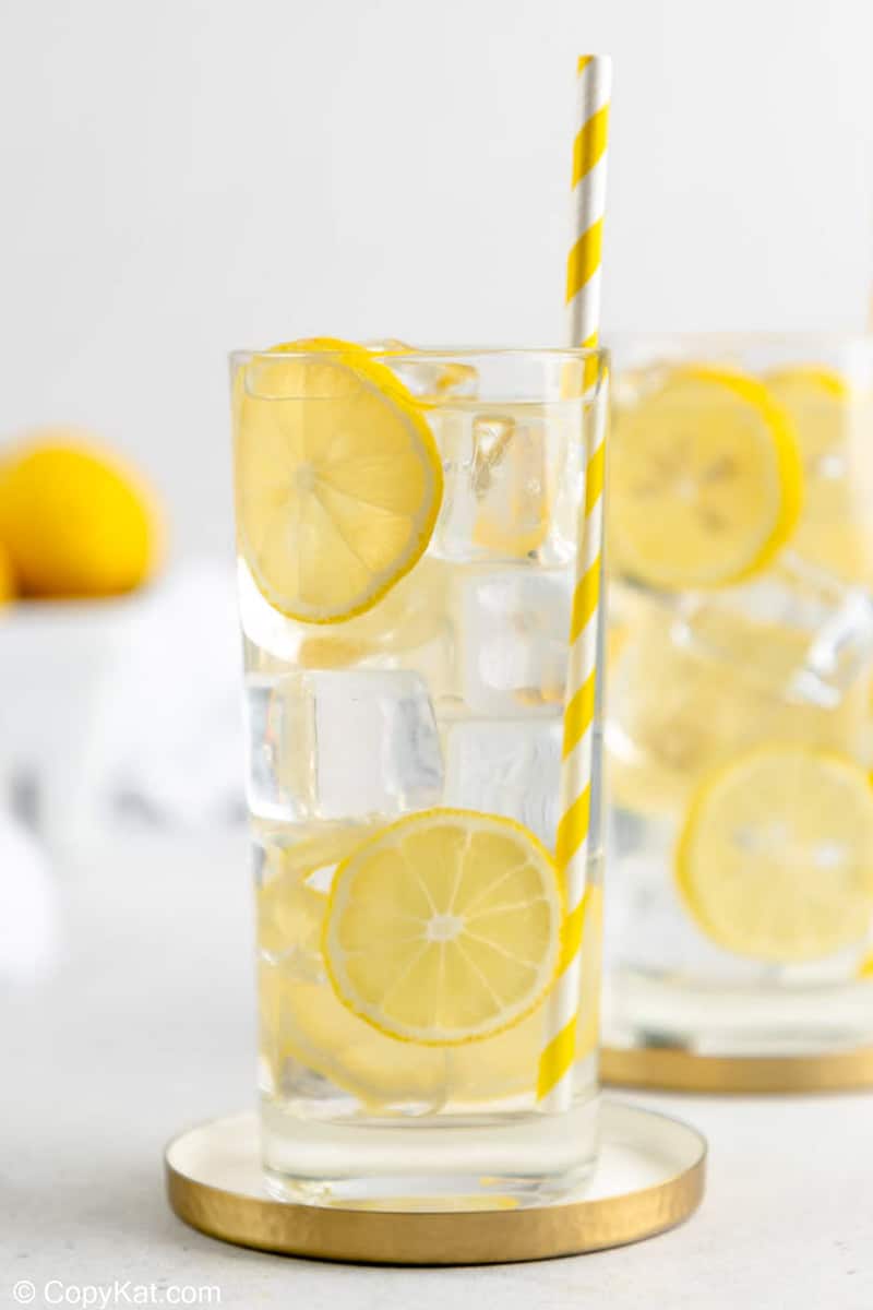 a glass of homemade lemonade garnished with lemon slices.