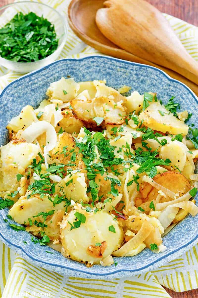 lyonnaise potatoes in a blue serving bowl.