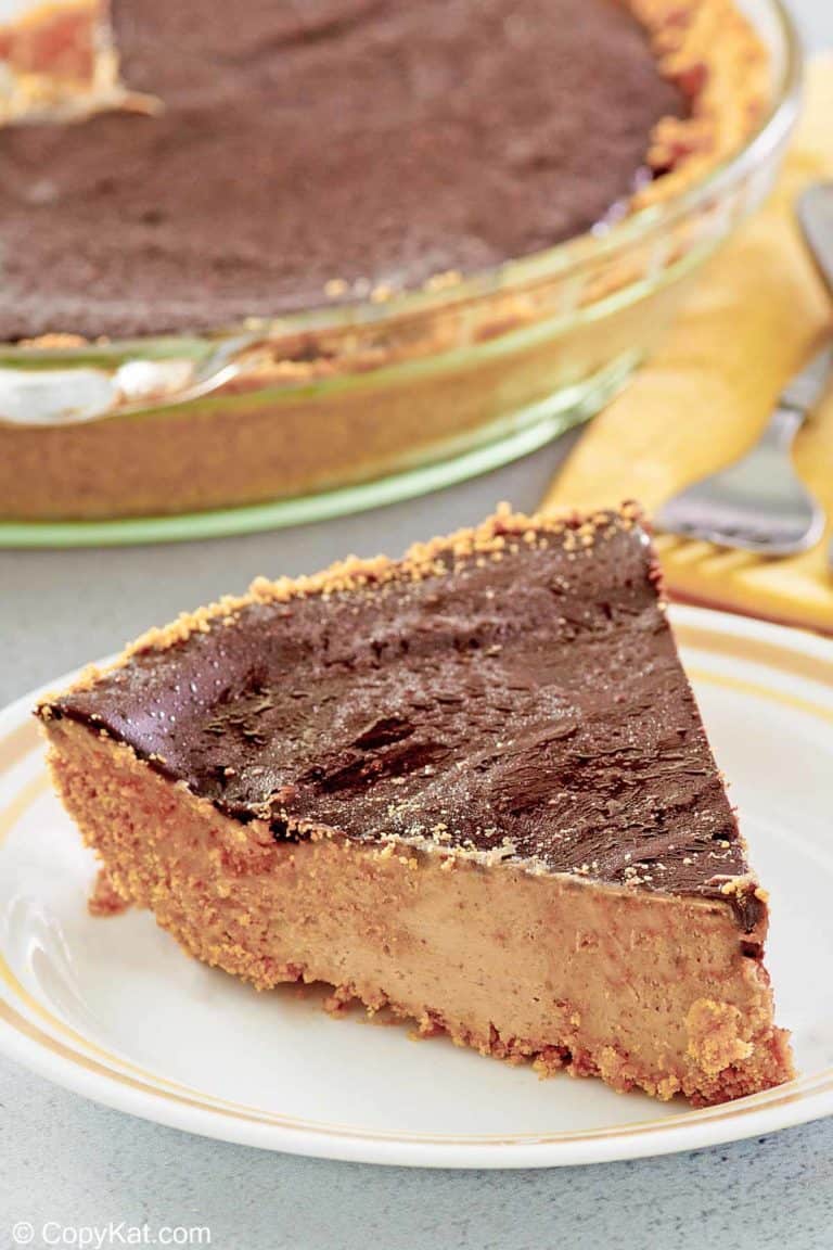 slice of chocolate peanut butter pie in front of the pie.