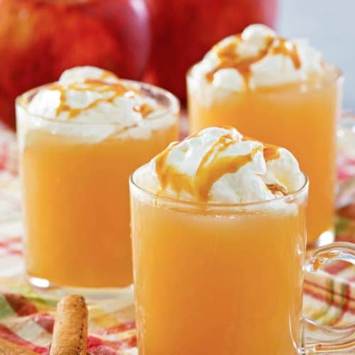 homemade Starbucks caramel apple spice drink in three mugs.