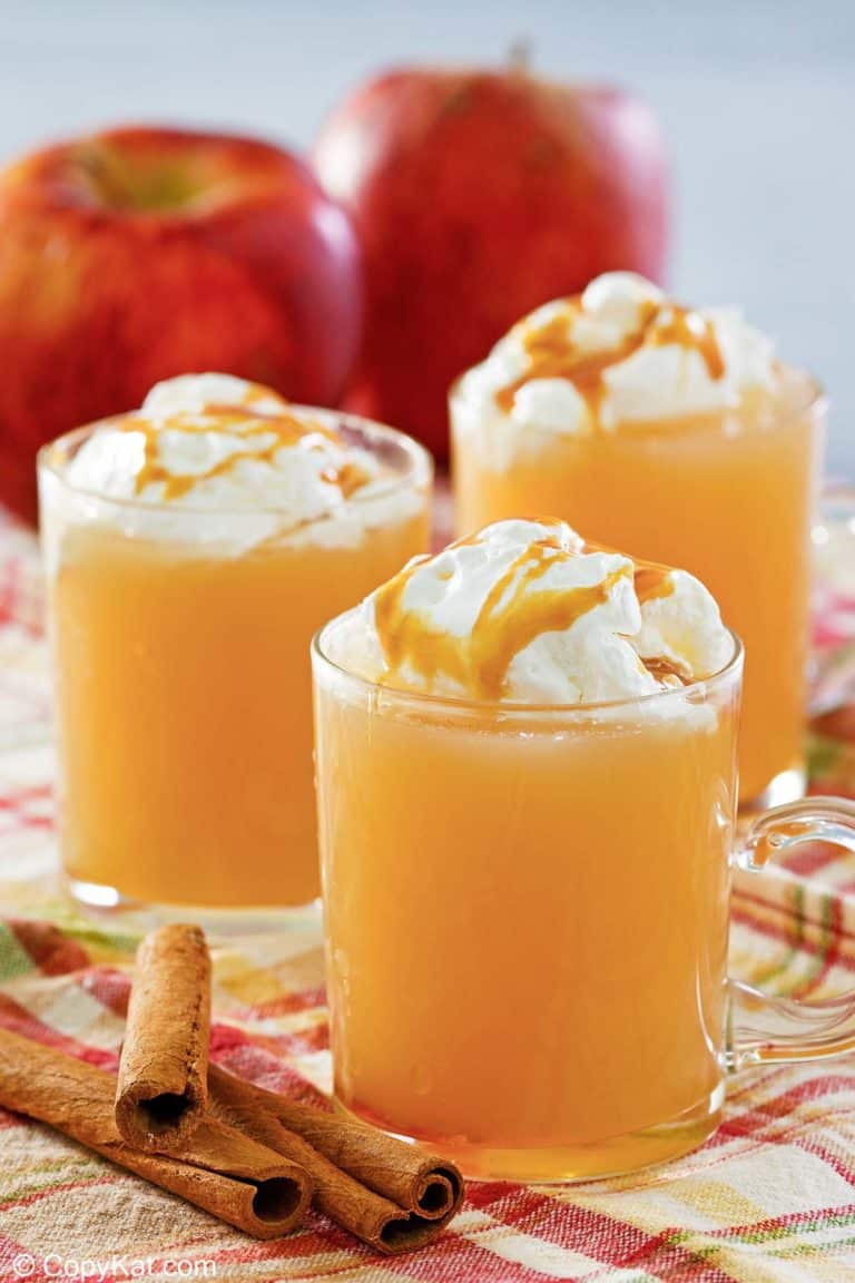 homemade Starbucks caramel apple spice drink in three mugs.