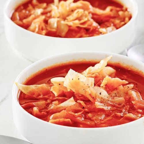 two bowls of homemade cabbage soup.