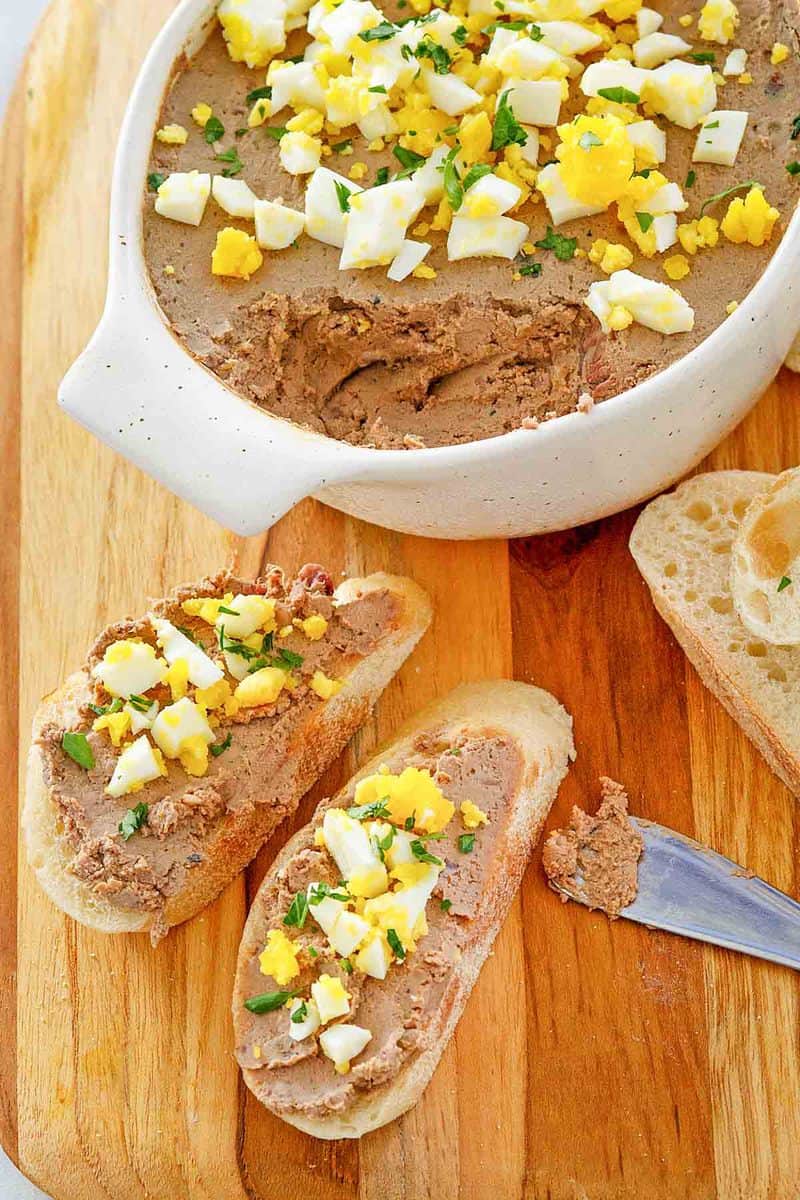 chicken liver pate on bread slices and in a dish.
