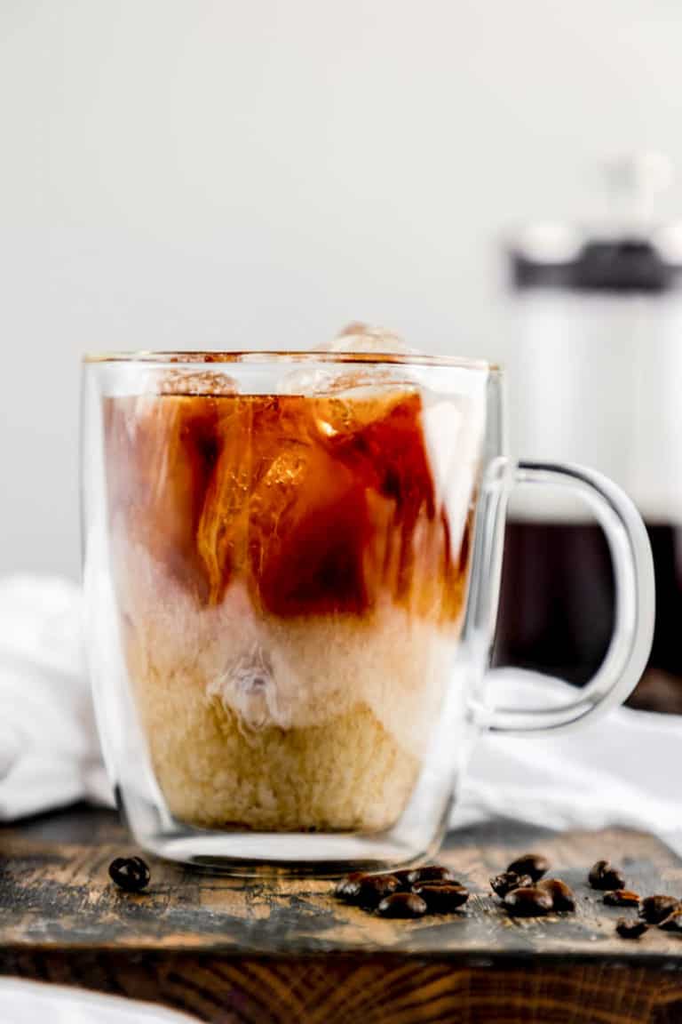 cup of iced cold brew coffee with cream.