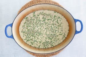 creamy seafood bisque liquid in a pot.