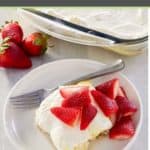 lemon lush dessert with fresh strawberries on top.
