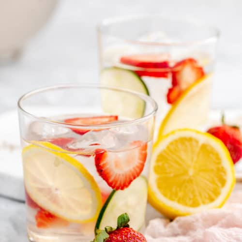 strawberry lemon cucumber water in glasses and fresh fruit.