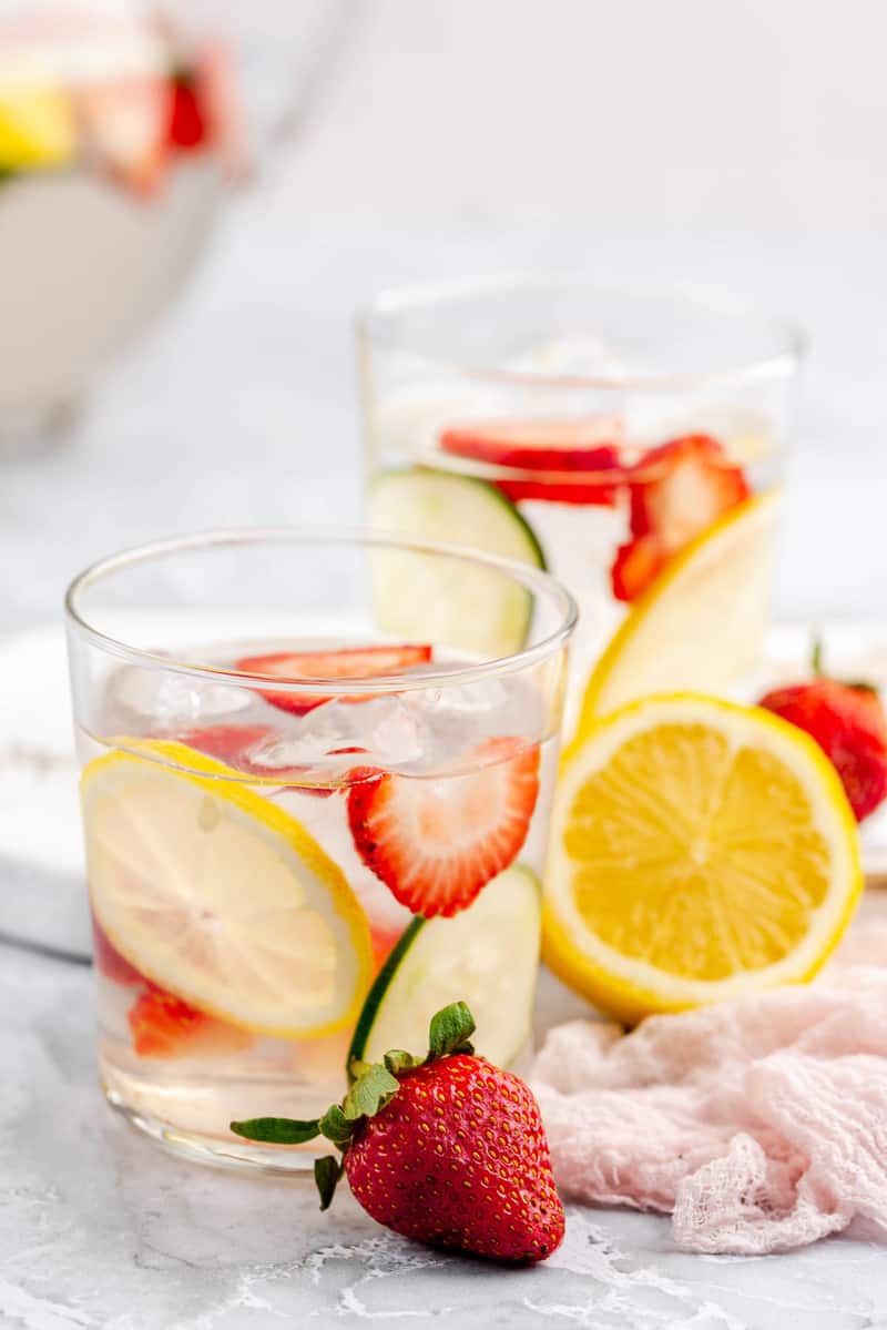 strawberry lemon cucumber water in glasses and fresh fruit.