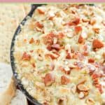 hot bacon and swiss cheese dip, crackers, and bread slices.