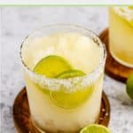 beer margarita garnished with salt rim and lime slices.