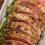 sliced smoked eye of round roast on a platter.