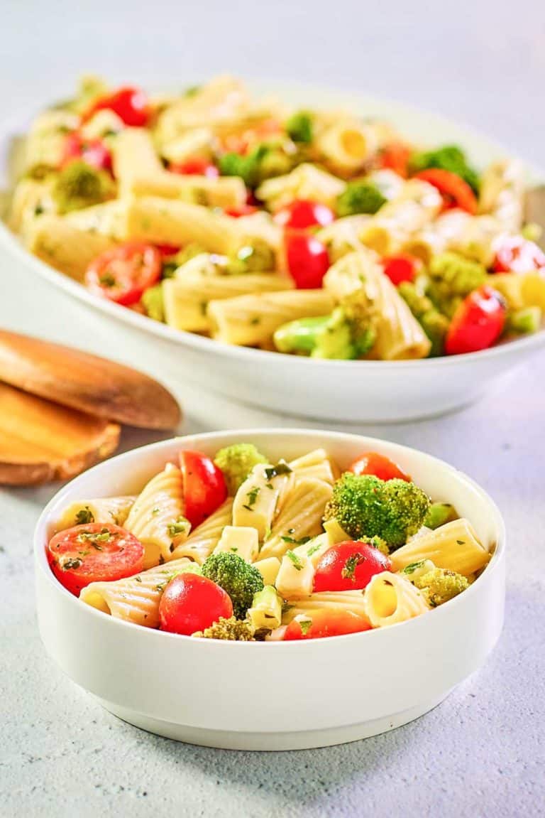 broccoli pasta salad in a bowl and on a large platter.