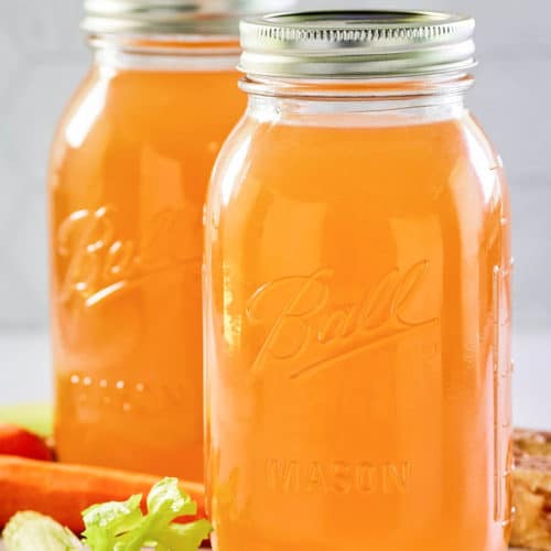 Instant Pot beef bone broth in two mason jars.