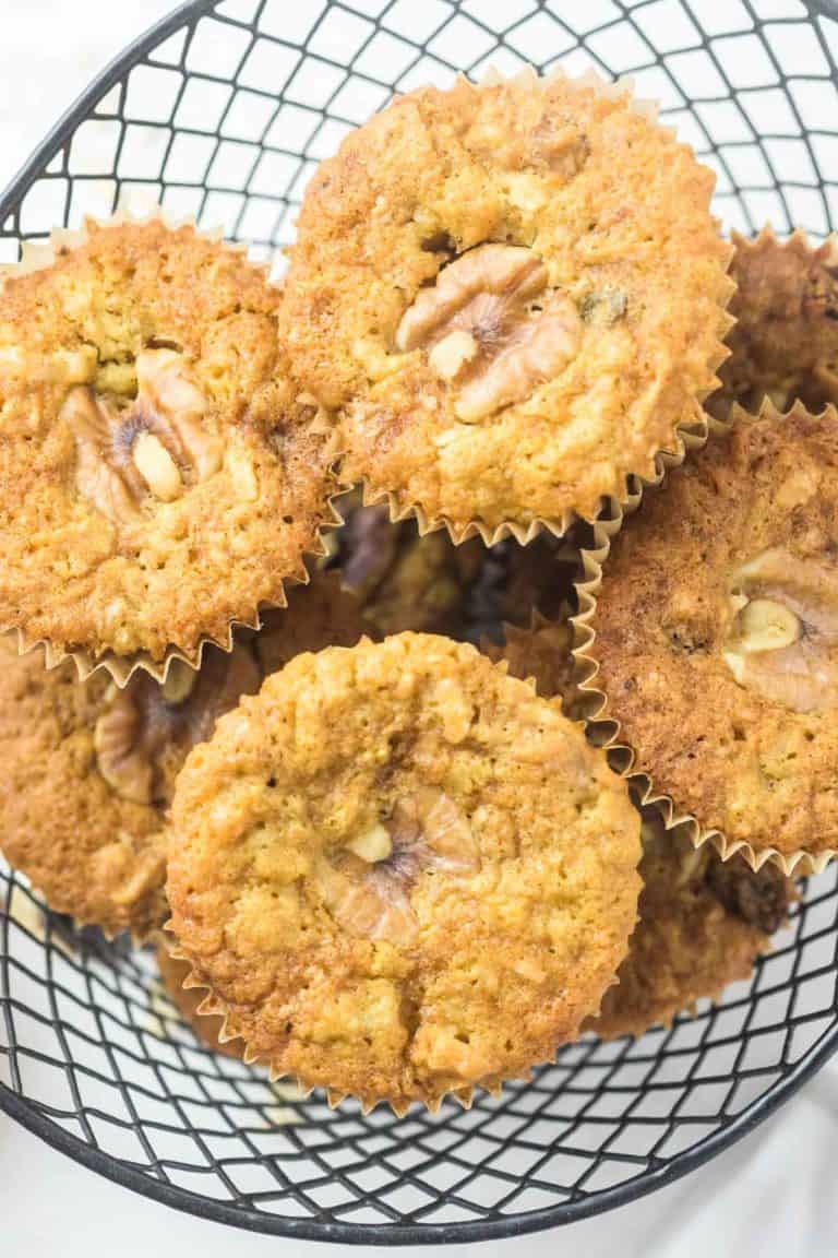 oatmeal raisin muffins with walnuts and coconut in a basket.