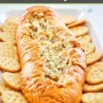 Mississippi sin dip with crackers on a platter.
