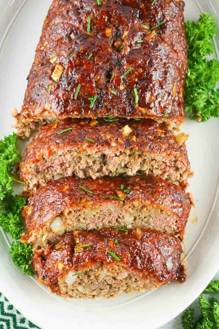 overhead view of smoked meatloaf on a platter.