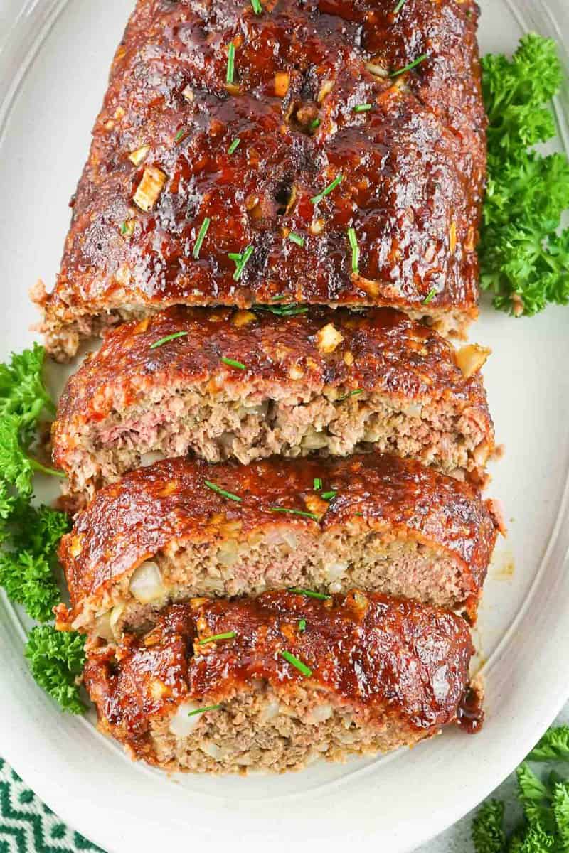 overhead view of smoked meatloaf on a platter.