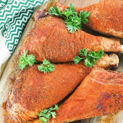 overhead view of four homemade smoked turkey legs.