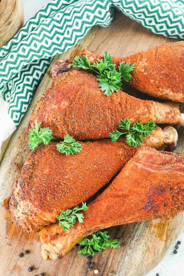 overhead view of four homemade smoked turkey legs.