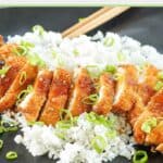chicken katsu over white rice on a platter.