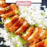 overhead view of chicken katsu with tonkatsu sauce over rice.