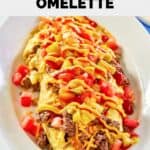 homemade IHOP cheeseburger omelette on an oval plate.