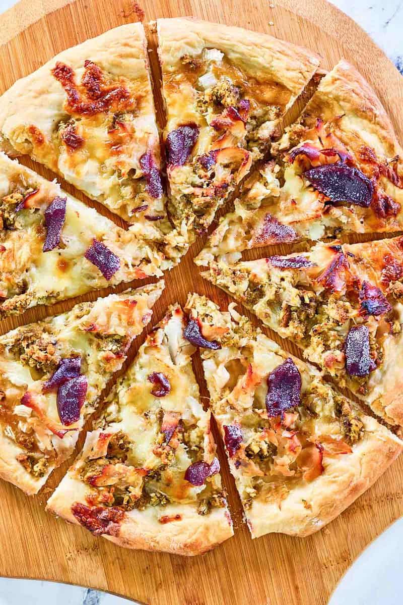overhead view of Thanksgiving pizza on a pizza peel.