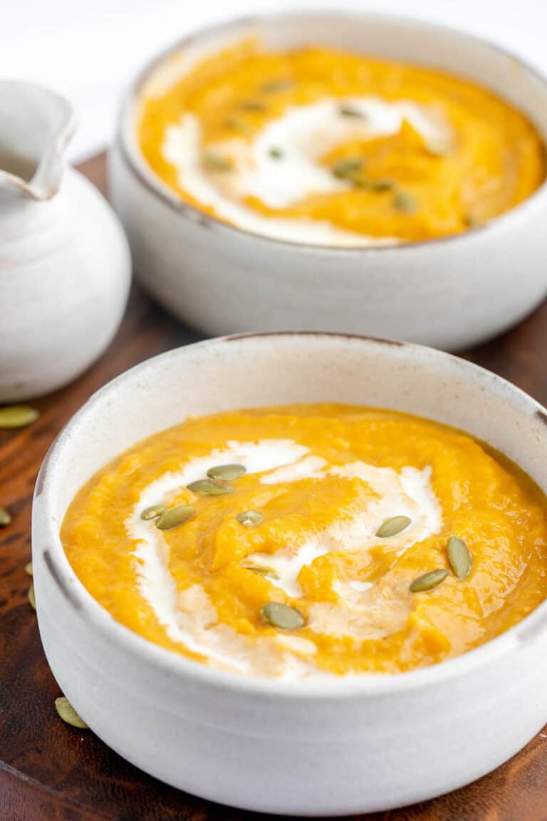 two bowls of copycat Panera autumn squash soup.