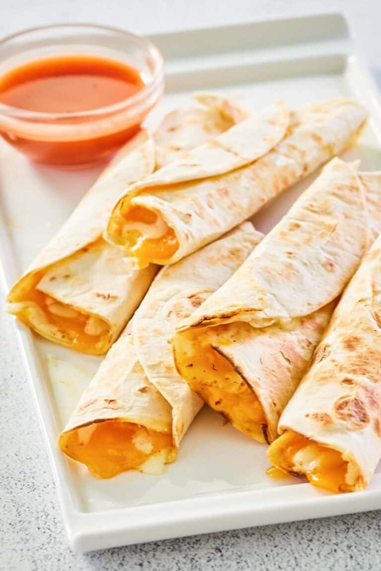five copycat Taco Bell cheesy roll ups on a platter.
