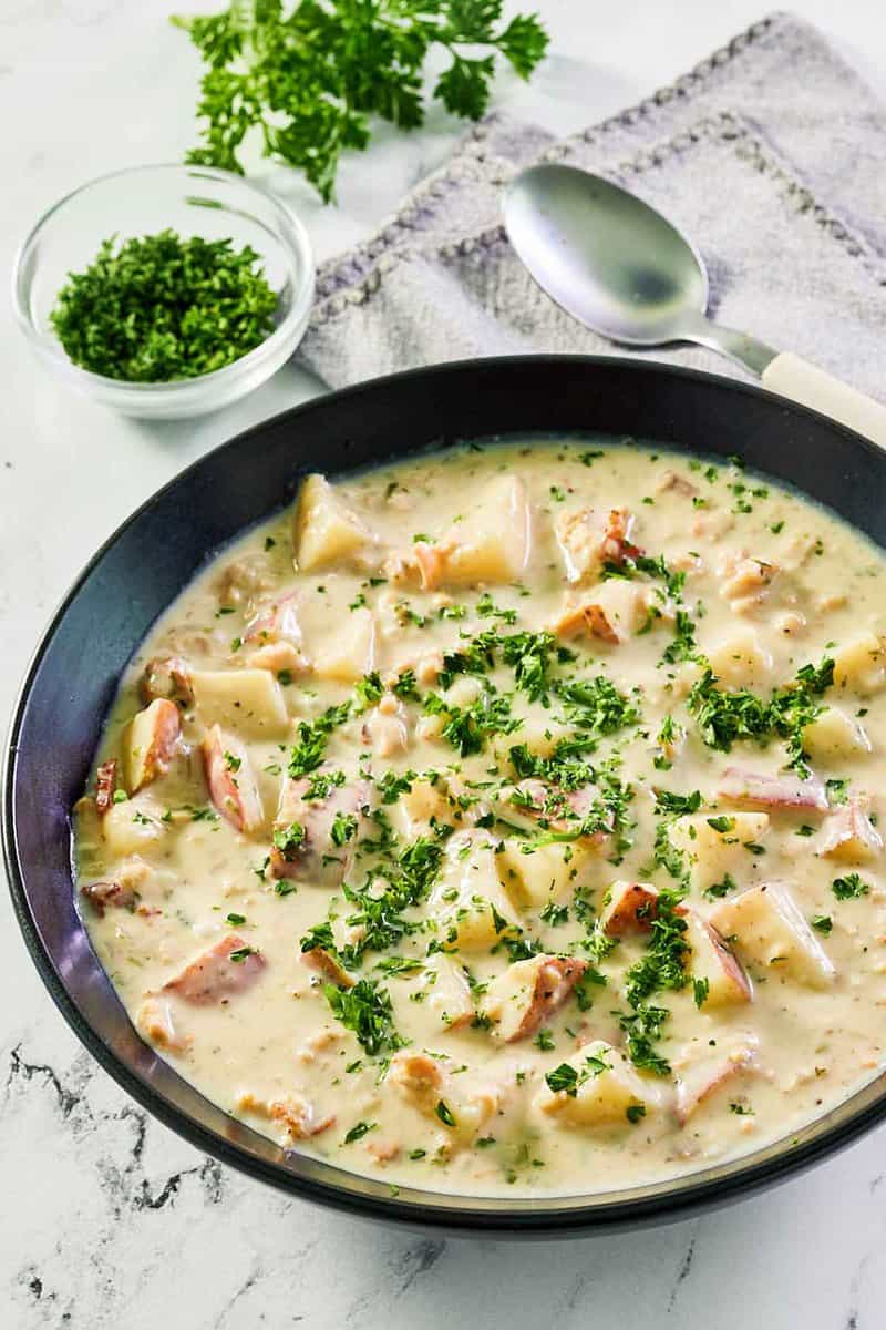 clam chowder in a black bowl.
