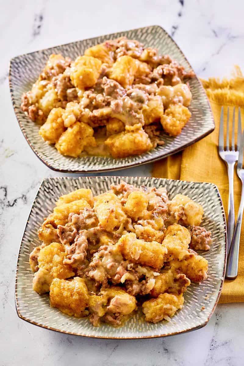 Mexican tater tot casserole on two plates.