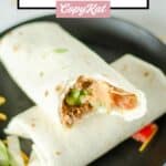 two copycat Taco Bell supreme burritos on a plate.