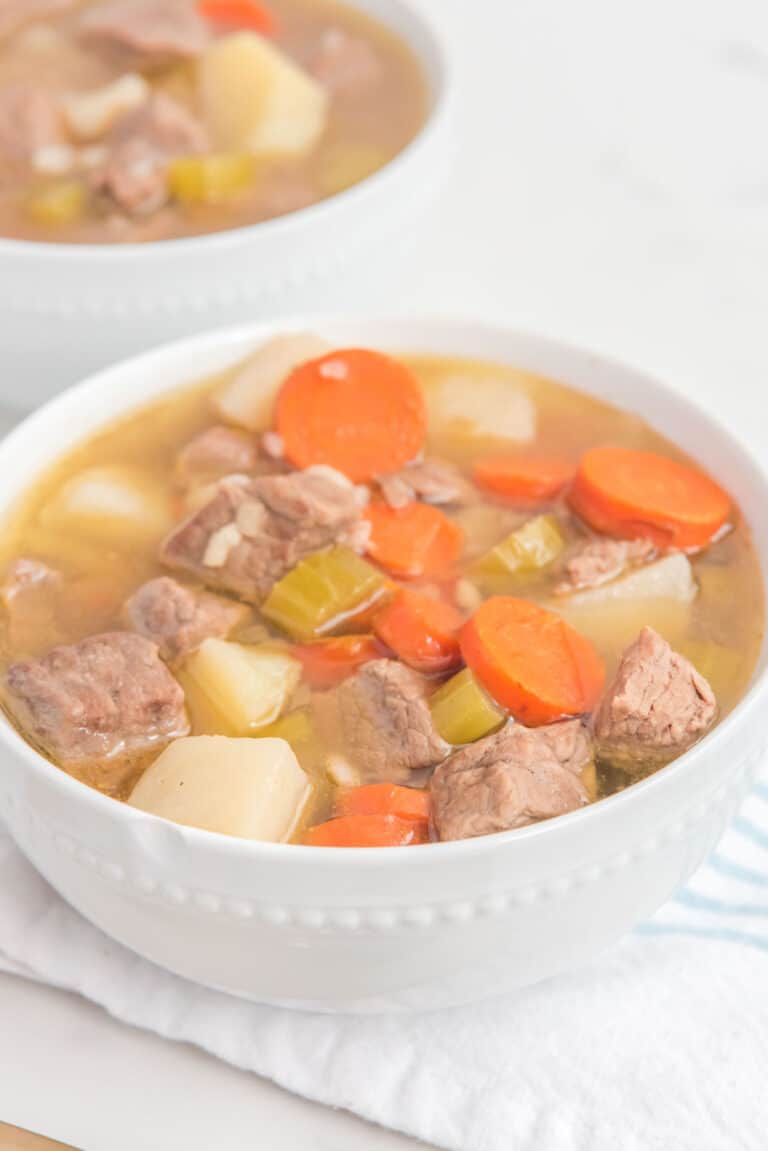 homemade Campbell's vegetable beef soup in two white bowls.
