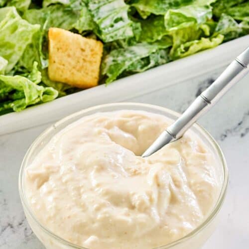creamy caesar dressing and a caesar salad.