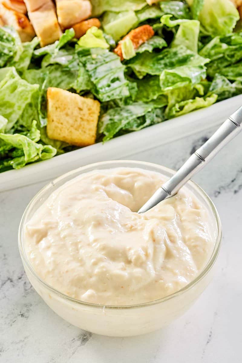 creamy caesar dressing and a caesar salad.