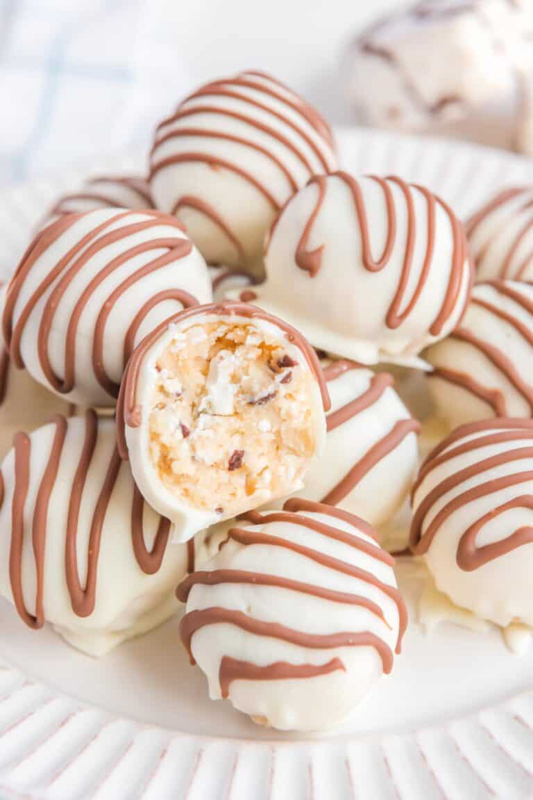 Little Debbie zebra cake truffles and one cut in half to show the inside.