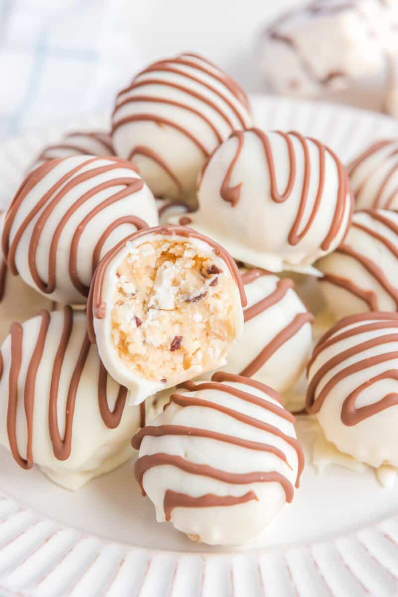 Little Debbie zebra cake truffles and one cut in half to show the inside.