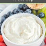 Cream cheese fruit dip in a bowl, fresh blueberries, and strawberries.